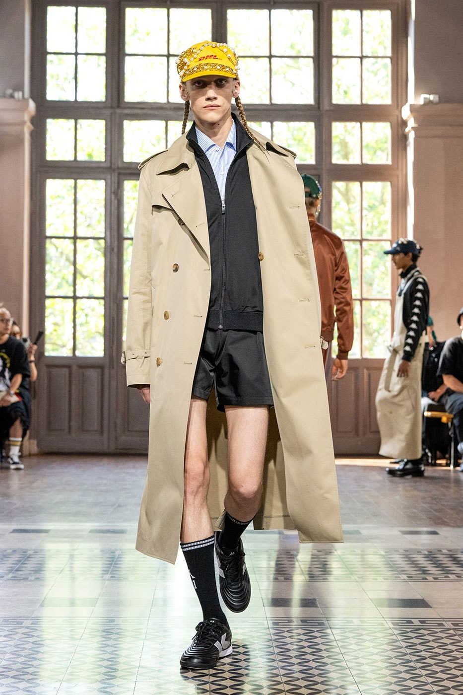 JUNYA WATANABE MAN SS27 Blends Streetwear Icons and Luxury Tailoring Under "BLING BLING BLING" Theme paris fashion week spring summer 2027 runway Kappa  Needles  Carhartt  Levi’s  Luigi Borrelli  Guy Rover  Maria Santangelo  INNERRAUM  47  HIDDEN   Union LA  DHL  Flake  New Balance  Heinrich Dinkelacker  Tricker's 