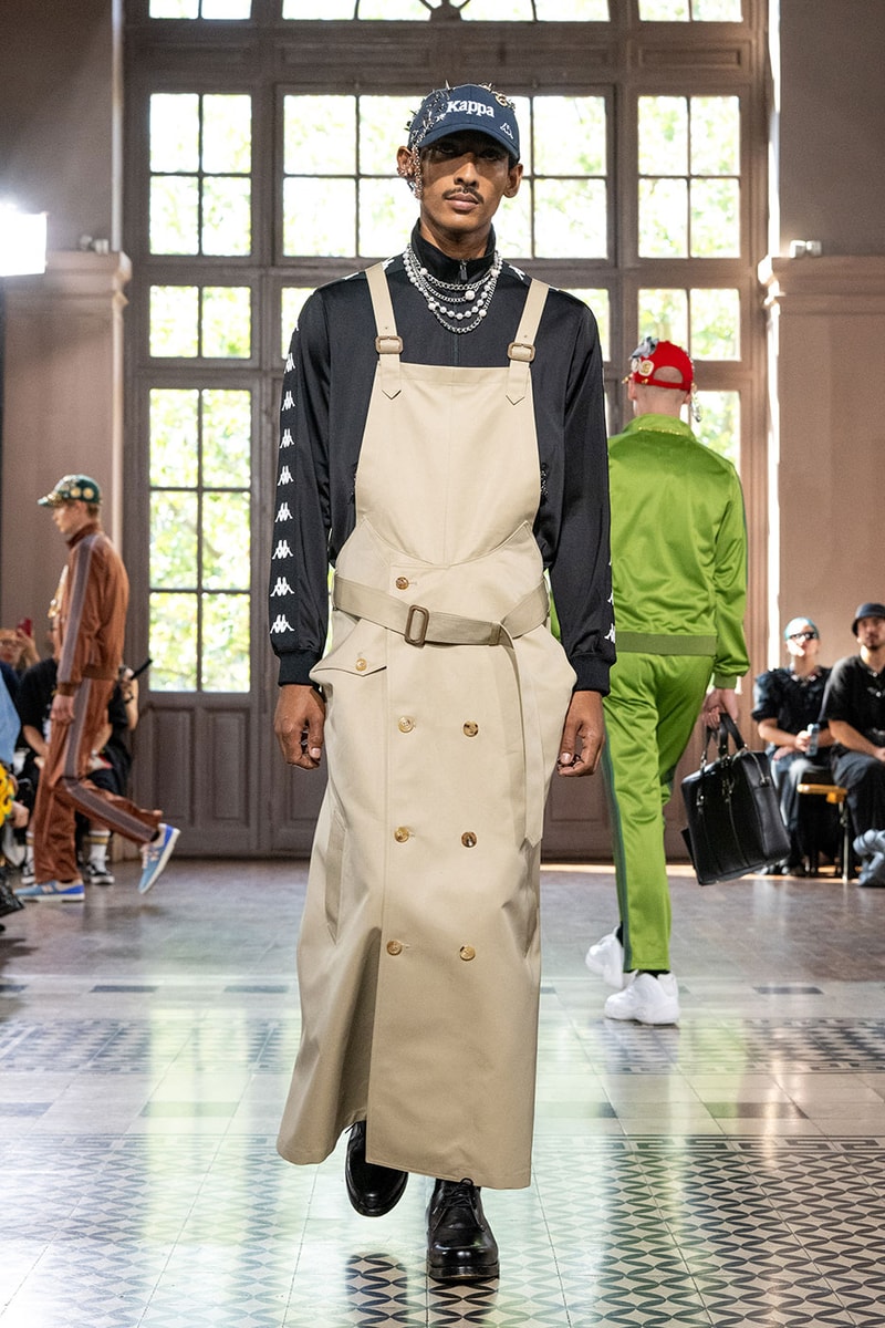 JUNYA WATANABE MAN SS27 Blends Streetwear Icons and Luxury Tailoring Under "BLING BLING BLING" Theme paris fashion week spring summer 2027 runway Kappa  Needles  Carhartt  Levi’s  Luigi Borrelli  Guy Rover  Maria Santangelo  INNERRAUM  47  HIDDEN   Union LA  DHL  Flake  New Balance  Heinrich Dinkelacker  Tricker's 