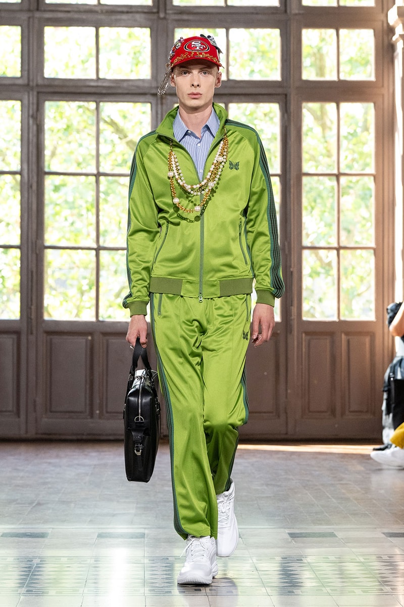JUNYA WATANABE MAN SS27 Blends Streetwear Icons and Luxury Tailoring Under "BLING BLING BLING" Theme paris fashion week spring summer 2027 runway Kappa  Needles  Carhartt  Levi’s  Luigi Borrelli  Guy Rover  Maria Santangelo  INNERRAUM  47  HIDDEN   Union LA  DHL  Flake  New Balance  Heinrich Dinkelacker  Tricker's 