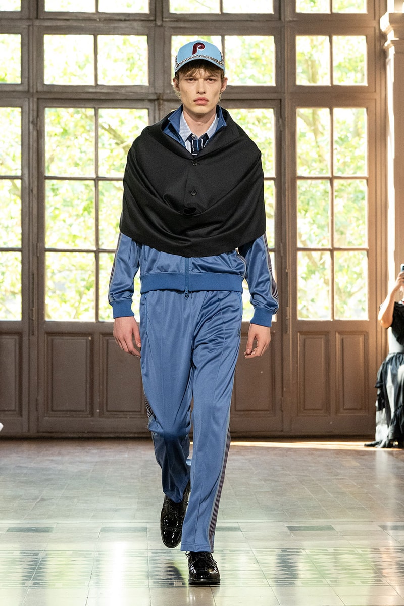 JUNYA WATANABE MAN SS27 Blends Streetwear Icons and Luxury Tailoring Under "BLING BLING BLING" Theme paris fashion week spring summer 2027 runway Kappa  Needles  Carhartt  Levi’s  Luigi Borrelli  Guy Rover  Maria Santangelo  INNERRAUM  47  HIDDEN   Union LA  DHL  Flake  New Balance  Heinrich Dinkelacker  Tricker's 