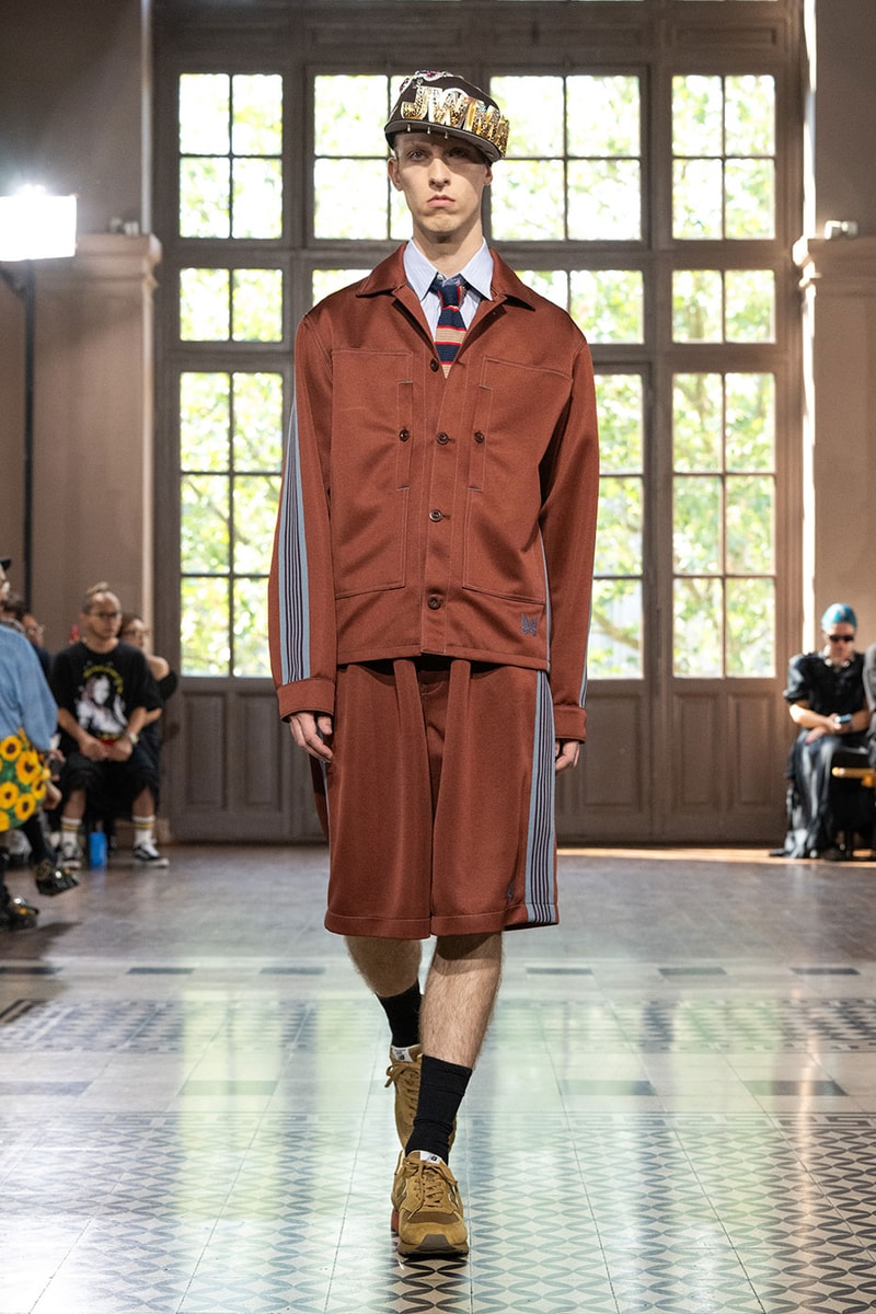 JUNYA WATANABE MAN SS27 Blends Streetwear Icons and Luxury Tailoring Under "BLING BLING BLING" Theme paris fashion week spring summer 2027 runway Kappa  Needles  Carhartt  Levi’s  Luigi Borrelli  Guy Rover  Maria Santangelo  INNERRAUM  47  HIDDEN   Union LA  DHL  Flake  New Balance  Heinrich Dinkelacker  Tricker's 