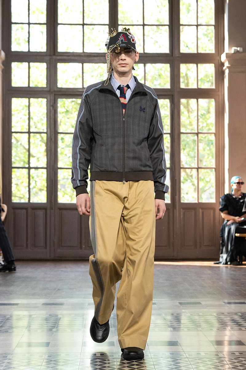 JUNYA WATANABE MAN SS27 Blends Streetwear Icons and Luxury Tailoring Under "BLING BLING BLING" Theme paris fashion week spring summer 2027 runway Kappa  Needles  Carhartt  Levi’s  Luigi Borrelli  Guy Rover  Maria Santangelo  INNERRAUM  47  HIDDEN   Union LA  DHL  Flake  New Balance  Heinrich Dinkelacker  Tricker's 