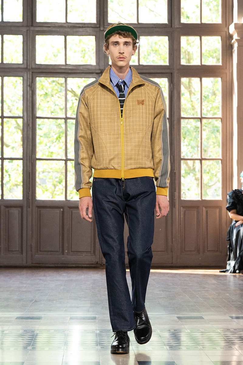 JUNYA WATANABE MAN SS27 Blends Streetwear Icons and Luxury Tailoring Under "BLING BLING BLING" Theme paris fashion week spring summer 2027 runway Kappa  Needles  Carhartt  Levi’s  Luigi Borrelli  Guy Rover  Maria Santangelo  INNERRAUM  47  HIDDEN   Union LA  DHL  Flake  New Balance  Heinrich Dinkelacker  Tricker's 