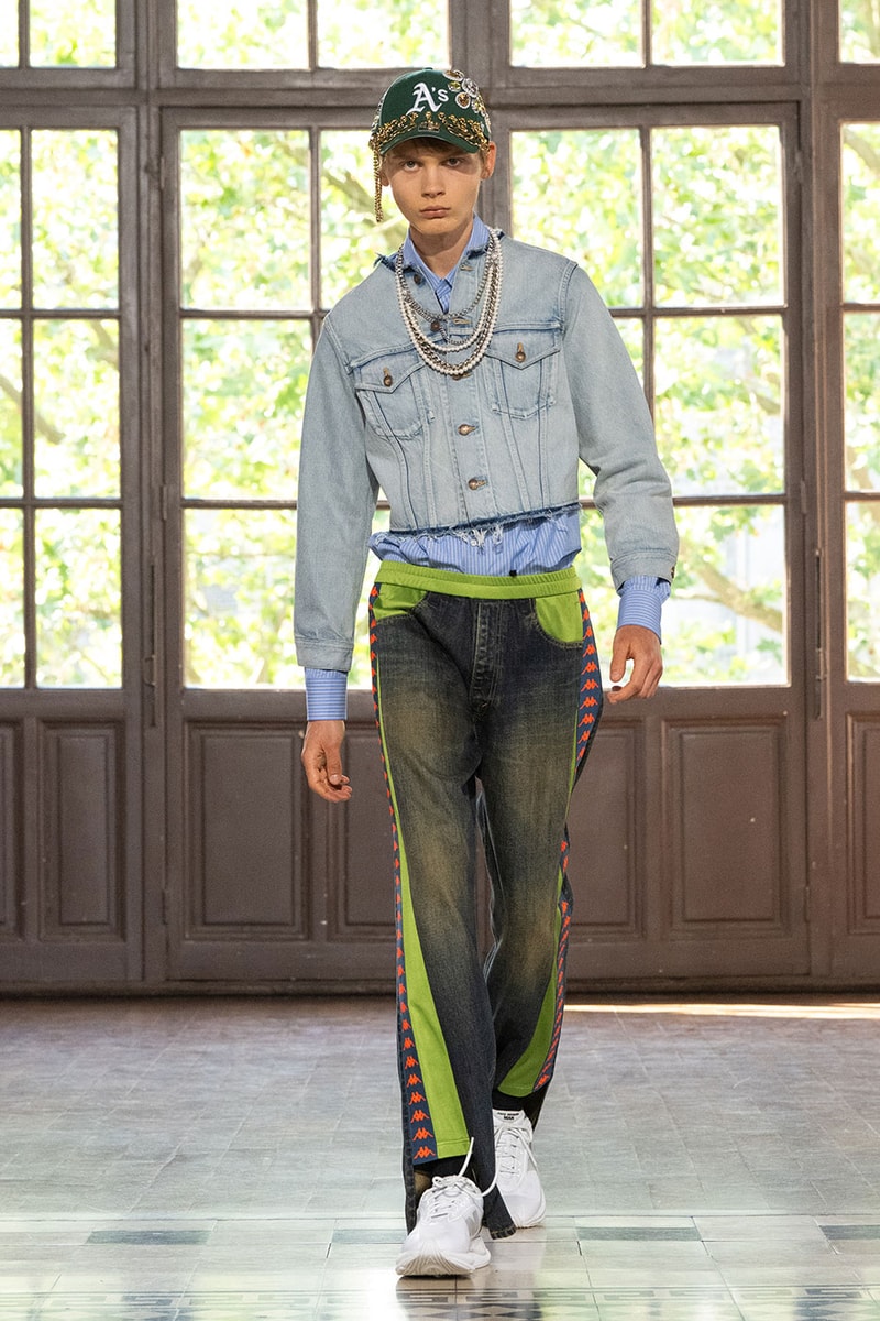 JUNYA WATANABE MAN SS27 Blends Streetwear Icons and Luxury Tailoring Under "BLING BLING BLING" Theme paris fashion week spring summer 2027 runway Kappa  Needles  Carhartt  Levi’s  Luigi Borrelli  Guy Rover  Maria Santangelo  INNERRAUM  47  HIDDEN   Union LA  DHL  Flake  New Balance  Heinrich Dinkelacker  Tricker's 