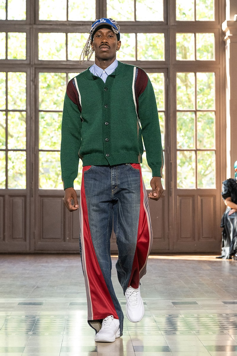 JUNYA WATANABE MAN SS27 Blends Streetwear Icons and Luxury Tailoring Under "BLING BLING BLING" Theme paris fashion week spring summer 2027 runway Kappa  Needles  Carhartt  Levi’s  Luigi Borrelli  Guy Rover  Maria Santangelo  INNERRAUM  47  HIDDEN   Union LA  DHL  Flake  New Balance  Heinrich Dinkelacker  Tricker's 