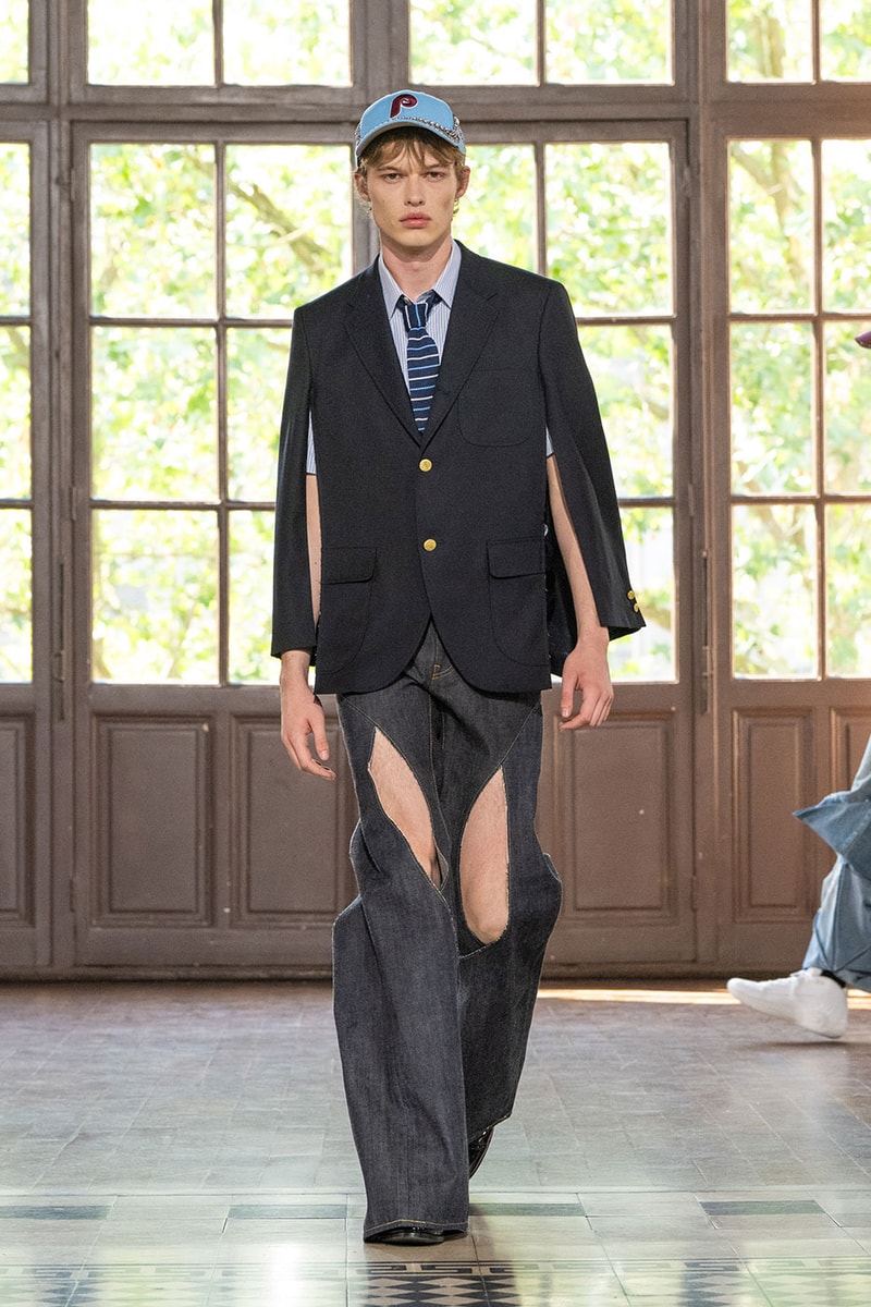 JUNYA WATANABE MAN SS27 Blends Streetwear Icons and Luxury Tailoring Under "BLING BLING BLING" Theme paris fashion week spring summer 2027 runway Kappa  Needles  Carhartt  Levi’s  Luigi Borrelli  Guy Rover  Maria Santangelo  INNERRAUM  47  HIDDEN   Union LA  DHL  Flake  New Balance  Heinrich Dinkelacker  Tricker's 