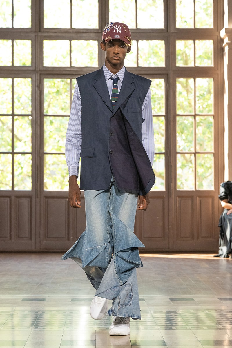 JUNYA WATANABE MAN SS27 Blends Streetwear Icons and Luxury Tailoring Under "BLING BLING BLING" Theme paris fashion week spring summer 2027 runway Kappa  Needles  Carhartt  Levi’s  Luigi Borrelli  Guy Rover  Maria Santangelo  INNERRAUM  47  HIDDEN   Union LA  DHL  Flake  New Balance  Heinrich Dinkelacker  Tricker's 