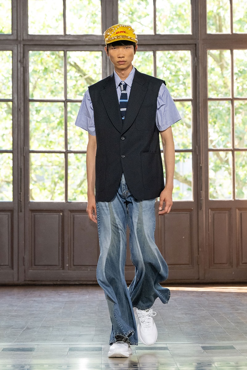 JUNYA WATANABE MAN SS27 Blends Streetwear Icons and Luxury Tailoring Under "BLING BLING BLING" Theme paris fashion week spring summer 2027 runway Kappa  Needles  Carhartt  Levi’s  Luigi Borrelli  Guy Rover  Maria Santangelo  INNERRAUM  47  HIDDEN   Union LA  DHL  Flake  New Balance  Heinrich Dinkelacker  Tricker's 