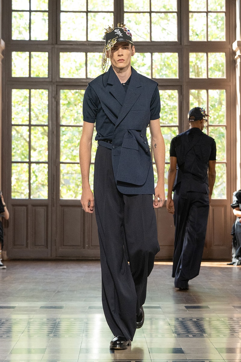 JUNYA WATANABE MAN SS27 Blends Streetwear Icons and Luxury Tailoring Under "BLING BLING BLING" Theme paris fashion week spring summer 2027 runway Kappa  Needles  Carhartt  Levi’s  Luigi Borrelli  Guy Rover  Maria Santangelo  INNERRAUM  47  HIDDEN   Union LA  DHL  Flake  New Balance  Heinrich Dinkelacker  Tricker's 