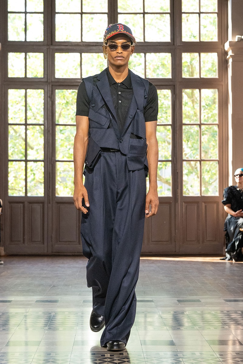 JUNYA WATANABE MAN SS27 Blends Streetwear Icons and Luxury Tailoring Under "BLING BLING BLING" Theme paris fashion week spring summer 2027 runway Kappa  Needles  Carhartt  Levi’s  Luigi Borrelli  Guy Rover  Maria Santangelo  INNERRAUM  47  HIDDEN   Union LA  DHL  Flake  New Balance  Heinrich Dinkelacker  Tricker's 