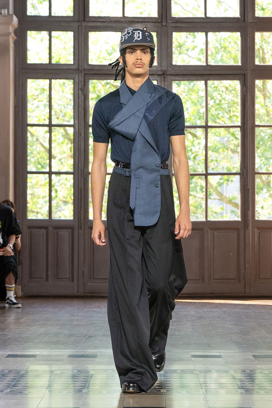 JUNYA WATANABE MAN SS27 Blends Streetwear Icons and Luxury Tailoring Under "BLING BLING BLING" Theme paris fashion week spring summer 2027 runway Kappa  Needles  Carhartt  Levi’s  Luigi Borrelli  Guy Rover  Maria Santangelo  INNERRAUM  47  HIDDEN   Union LA  DHL  Flake  New Balance  Heinrich Dinkelacker  Tricker's 