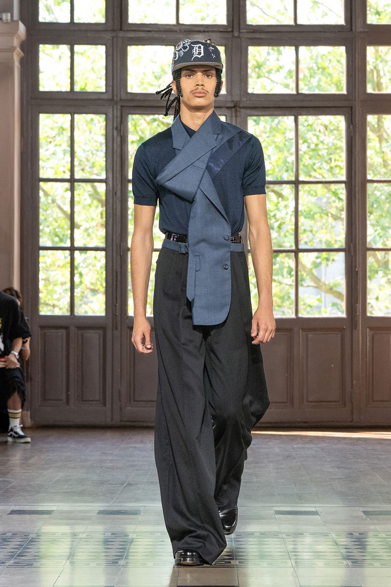 JUNYA WATANABE MAN SS27 Blends Streetwear Icons and Luxury Tailoring Under "BLING BLING BLING" Theme paris fashion week spring summer 2027 runway Kappa  Needles  Carhartt  Levi’s  Luigi Borrelli  Guy Rover  Maria Santangelo  INNERRAUM  47  HIDDEN   Union LA  DHL  Flake  New Balance  Heinrich Dinkelacker  Tricker's 
