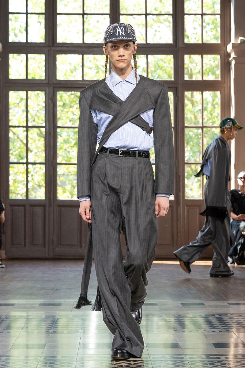 JUNYA WATANABE MAN SS27 Blends Streetwear Icons and Luxury Tailoring Under "BLING BLING BLING" Theme paris fashion week spring summer 2027 runway Kappa  Needles  Carhartt  Levi’s  Luigi Borrelli  Guy Rover  Maria Santangelo  INNERRAUM  47  HIDDEN   Union LA  DHL  Flake  New Balance  Heinrich Dinkelacker  Tricker's 