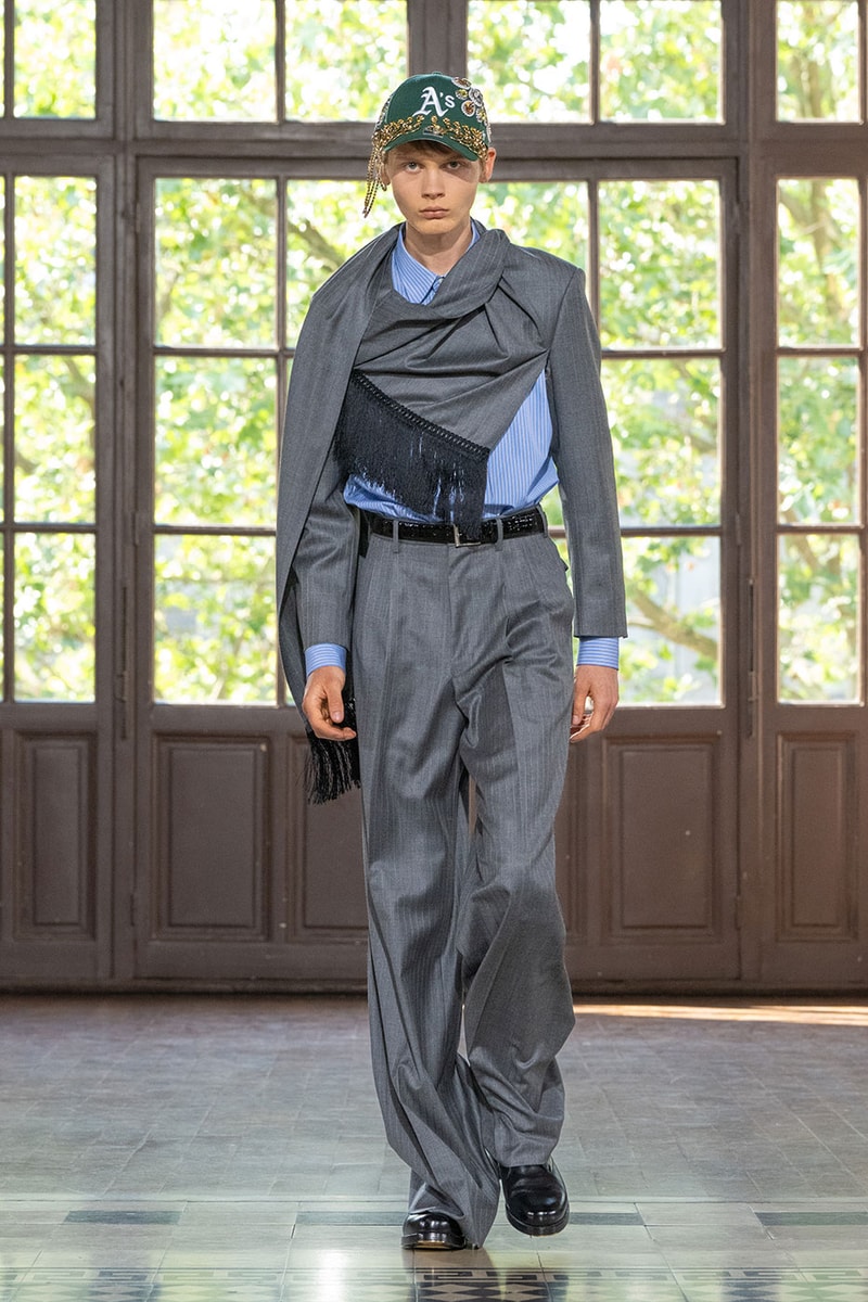 JUNYA WATANABE MAN SS27 Blends Streetwear Icons and Luxury Tailoring Under "BLING BLING BLING" Theme paris fashion week spring summer 2027 runway Kappa  Needles  Carhartt  Levi’s  Luigi Borrelli  Guy Rover  Maria Santangelo  INNERRAUM  47  HIDDEN   Union LA  DHL  Flake  New Balance  Heinrich Dinkelacker  Tricker's 
