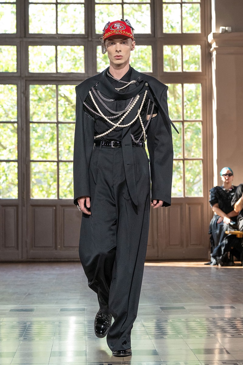JUNYA WATANABE MAN SS27 Blends Streetwear Icons and Luxury Tailoring Under "BLING BLING BLING" Theme paris fashion week spring summer 2027 runway Kappa  Needles  Carhartt  Levi’s  Luigi Borrelli  Guy Rover  Maria Santangelo  INNERRAUM  47  HIDDEN   Union LA  DHL  Flake  New Balance  Heinrich Dinkelacker  Tricker's 