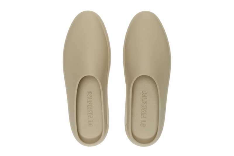 Fear of God Essentials California 1.0 slip-on in neutral Almond colorway, showing debossed logo and backless silhouette design - detail view 2