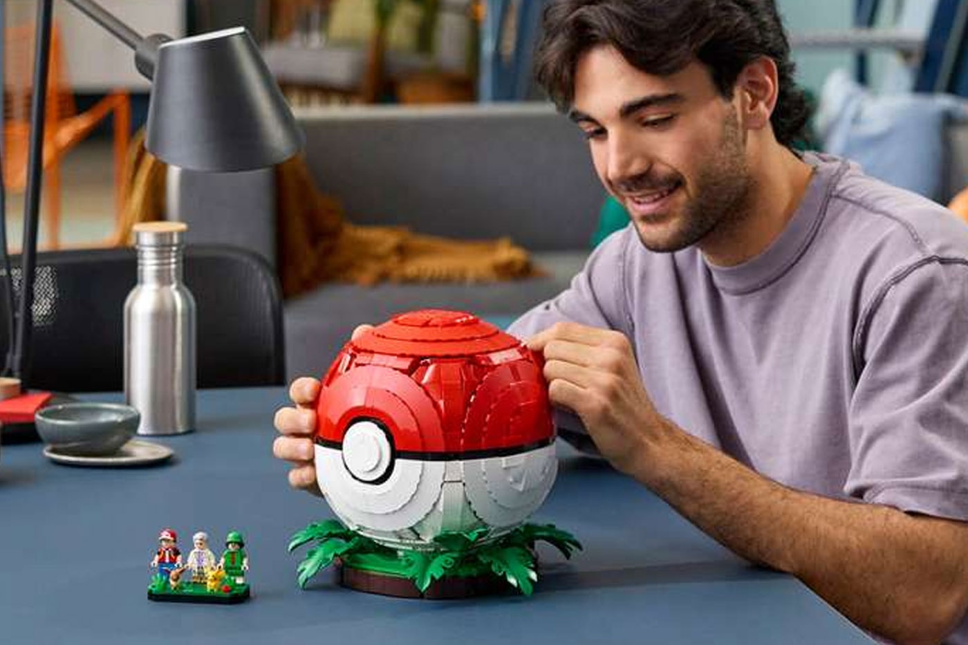 LEGO's "Iconic Trainer Moments" Poké Ball Is a Masterclass in Hidden Brick Construction first-ever human Pokémon minifigures collaboration pokemon professor oak famous laboratory