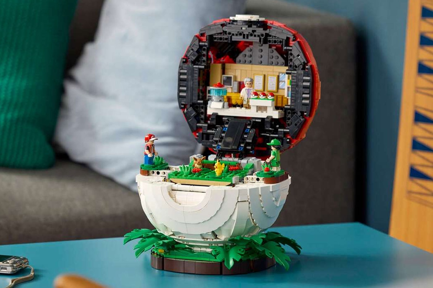 LEGO's "Iconic Trainer Moments" Poké Ball Is a Masterclass in Hidden Brick Construction first-ever human Pokémon minifigures collaboration pokemon professor oak famous laboratory