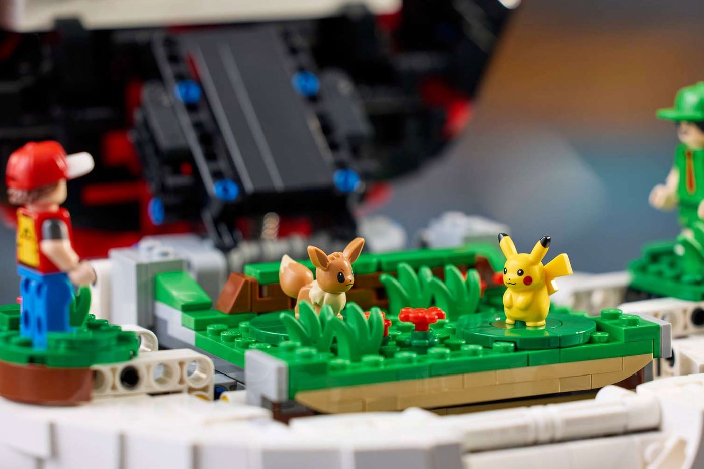LEGO's "Iconic Trainer Moments" Poké Ball Is a Masterclass in Hidden Brick Construction first-ever human Pokémon minifigures collaboration pokemon professor oak famous laboratory