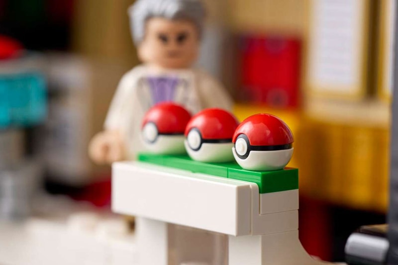 LEGO's "Iconic Trainer Moments" Poké Ball Is a Masterclass in Hidden Brick Construction first-ever human Pokémon minifigures collaboration pokemon professor oak famous laboratory
