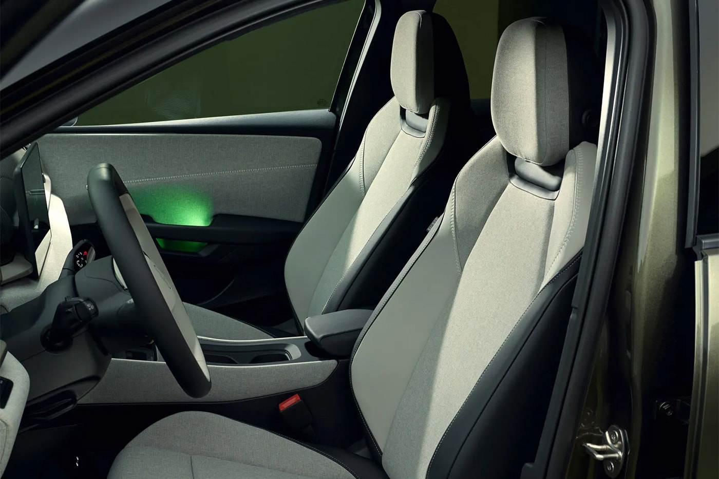 Volkswagen ID. Cross electric SUV on road showcasing compact proportions and clean LED lighting