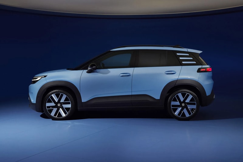 Volkswagen ID. Cross electric SUV on road showcasing compact proportions and clean LED lighting