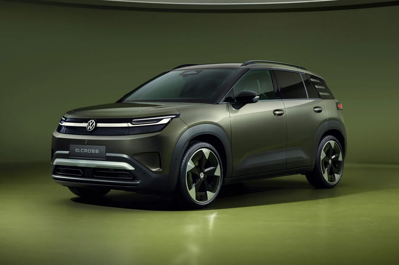 Volkswagen ID. Cross electric SUV on road showcasing compact proportions and clean LED lighting