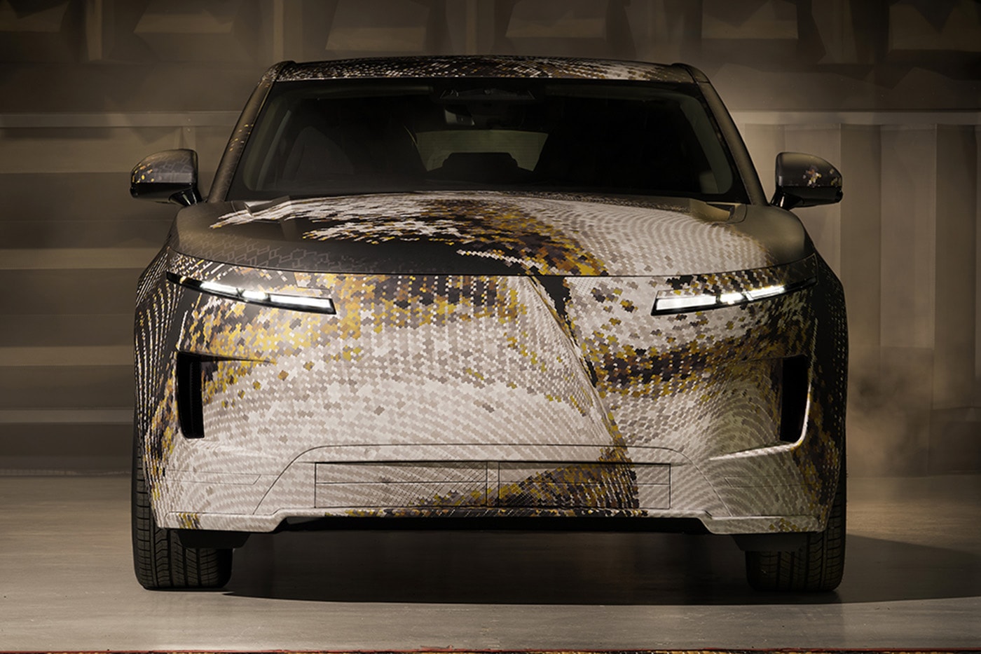 Range Rover GT prototype electric sport sedan in bespoke topographic camouflage