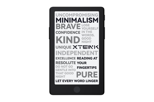 Xteink X4 Pro pocket e-reader with dual-tone frontlight attached magnetically to a smartphone