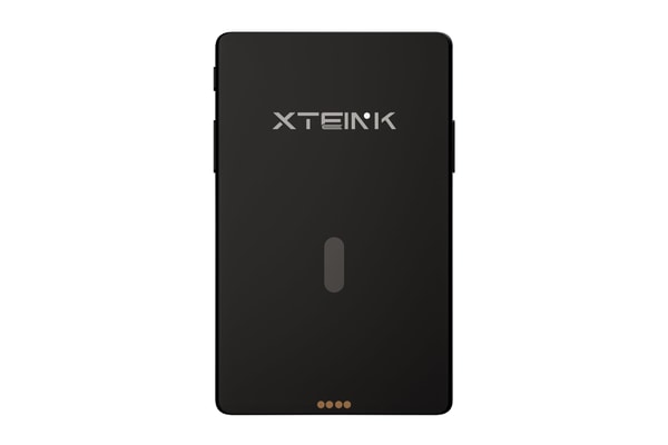 Xteink X4 Pro pocket e-reader with dual-tone frontlight attached magnetically to a smartphone