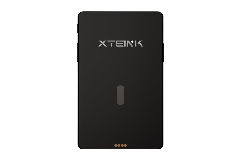 Xteink X4 Pro pocket e-reader with dual-tone frontlight attached magnetically to a smartphone