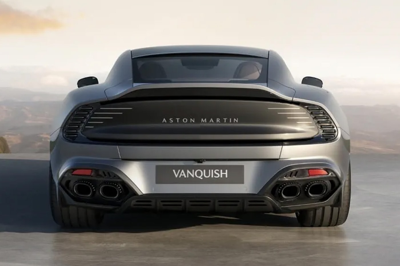 Aston Martin Vanquish 25 in Q Skye Silver showcasing 21-inch forged alloy wheels and V12 grand tourer profile