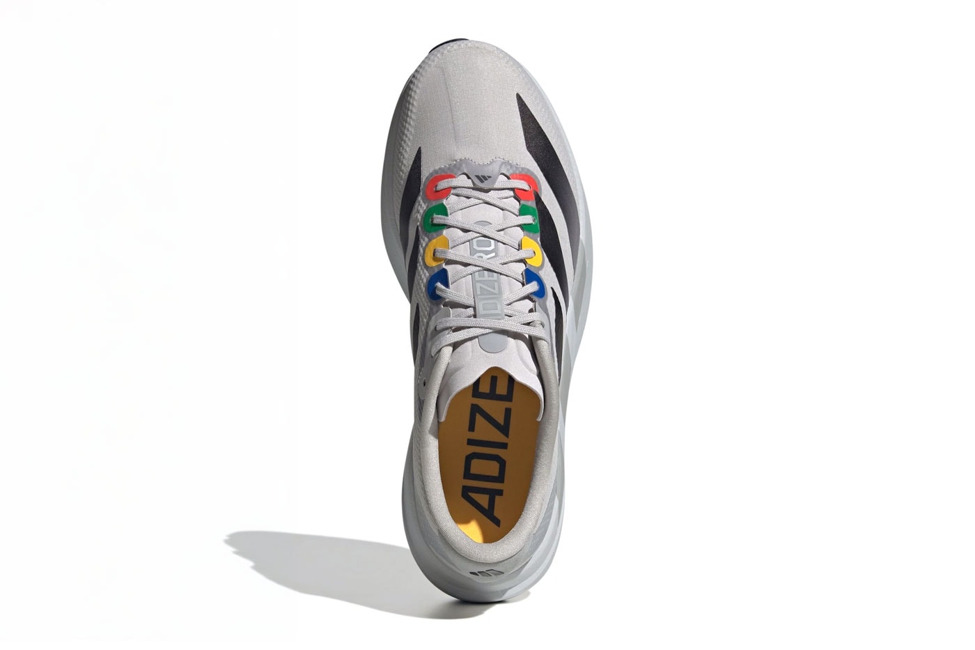Carnival and adidas Channel Retro Gaming on the Adizero EVO SL "The Grey Console" Grey/Black-Multi-Color KI0025 nintendo 64 playstation