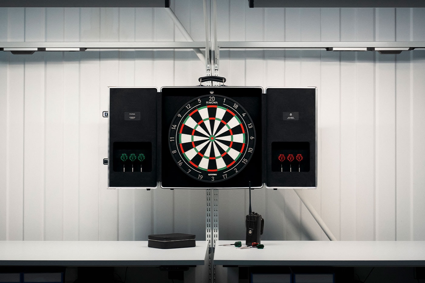 RIMOWA Unveils Limited-Edition Aluminium Dartboard Case With Winmau walton goggins campaign Grégoire Dyer