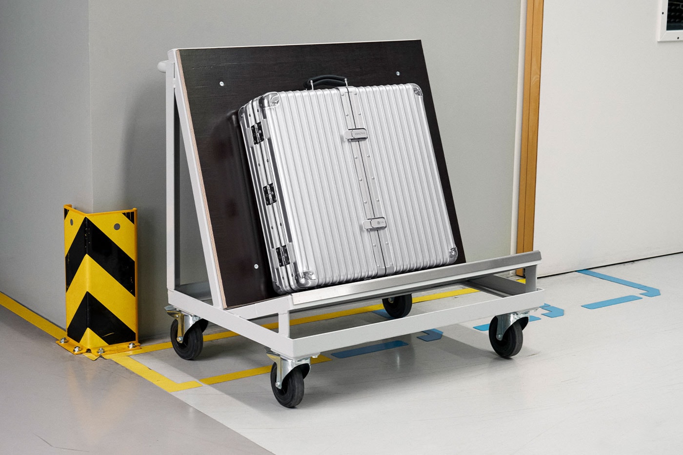 RIMOWA Unveils Limited-Edition Aluminium Dartboard Case With Winmau walton goggins campaign Grégoire Dyer