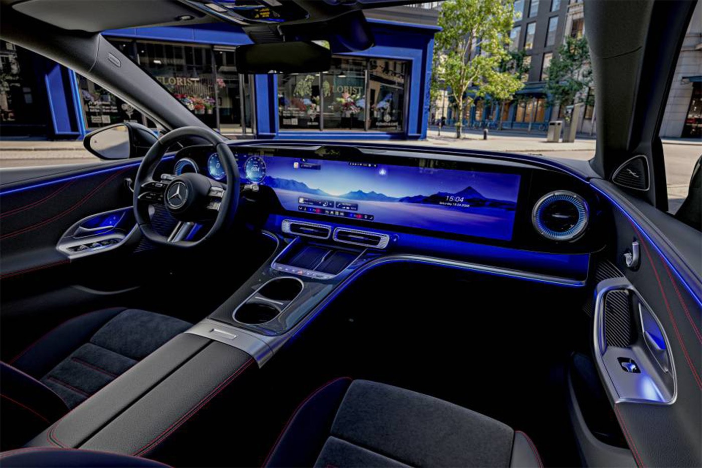 Mercedes-Benz interior showing MBUX Hyperscreen with restored physical buttons