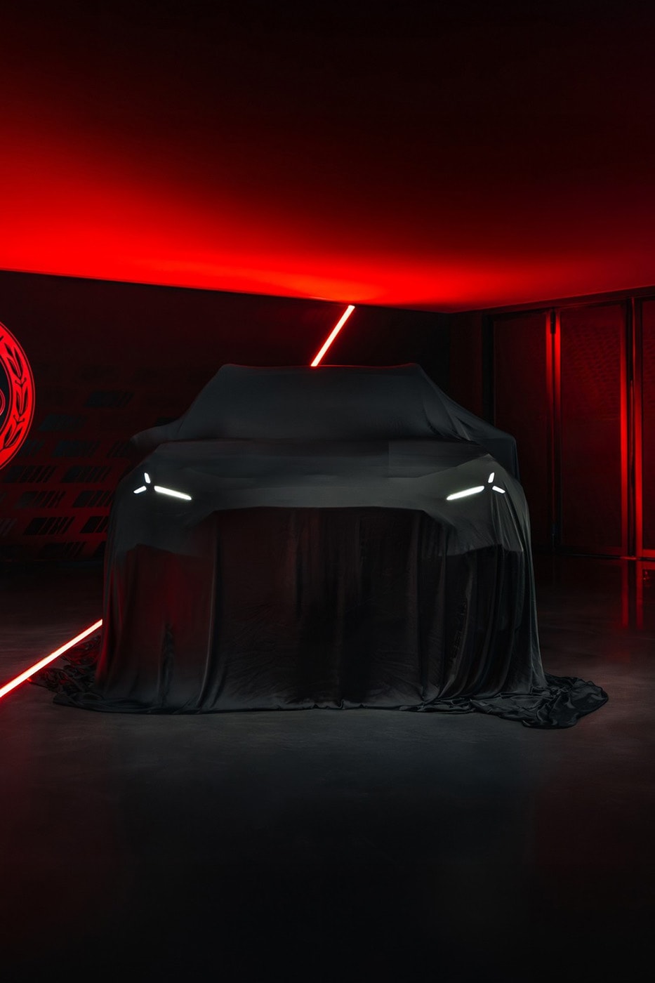 Mercedes-AMG GT 4-Door Coupe EV SUV teaser showing covered high-riding electric performance crossover silhouette