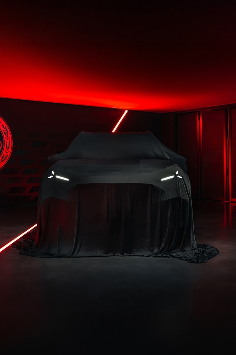 Mercedes-AMG GT 4-Door Coupe EV SUV teaser showing covered high-riding electric performance crossover silhouette