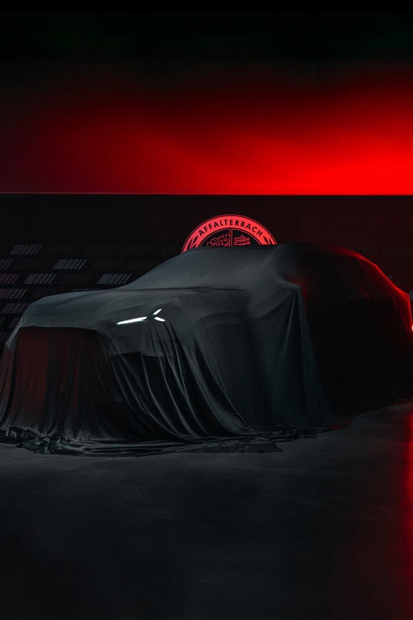 Mercedes-AMG GT 4-Door Coupe EV SUV teaser showing covered high-riding electric performance crossover silhouette