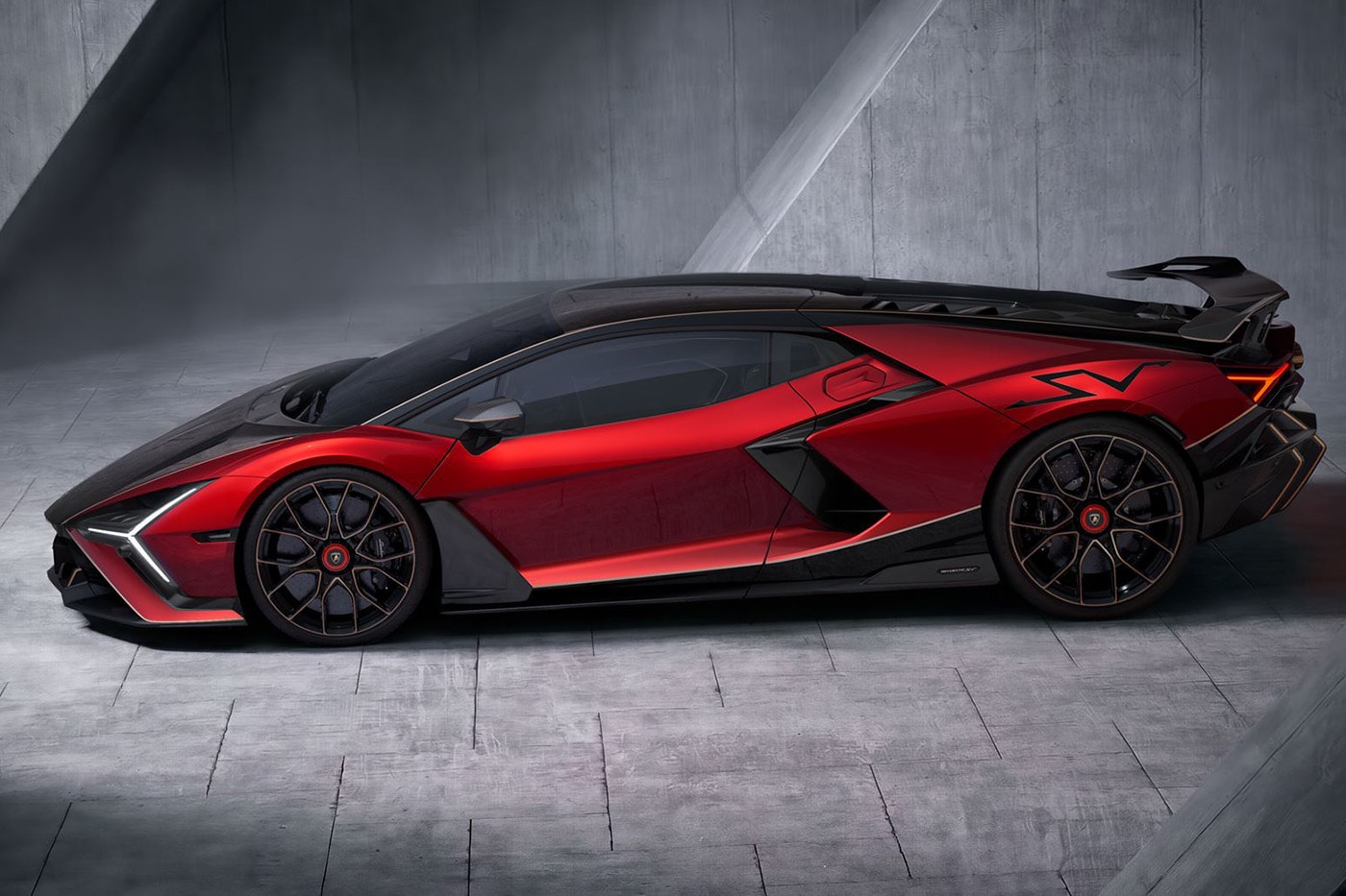Lamborghini Revuelto SV supercar with V-12 hybrid powertrain and fixed rear wing on track