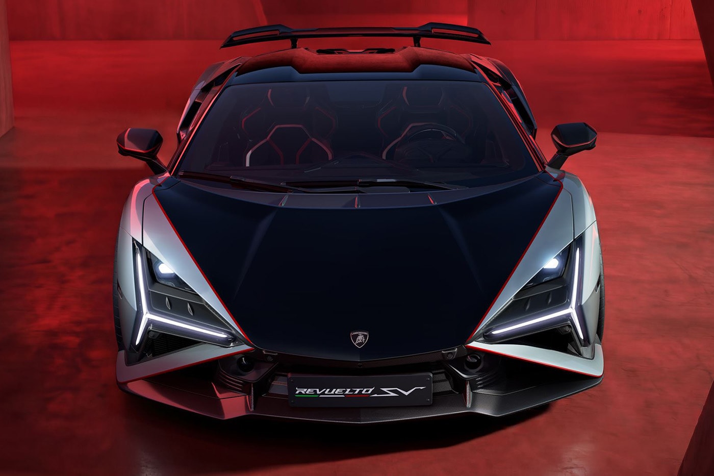 Lamborghini Revuelto SV supercar with V-12 hybrid powertrain and fixed rear wing on track
