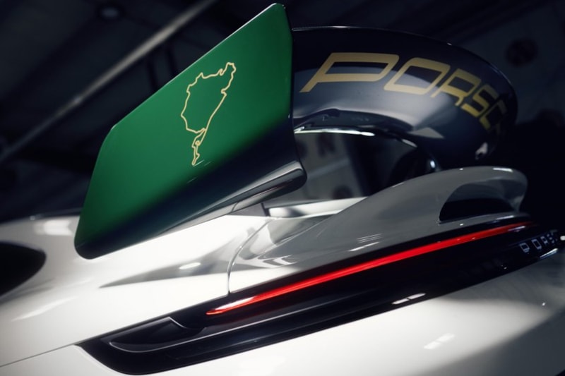 Porsche 911 GT3 100 Jahre Nürburgring in Green Hell livery with gold center-lock wheels on track