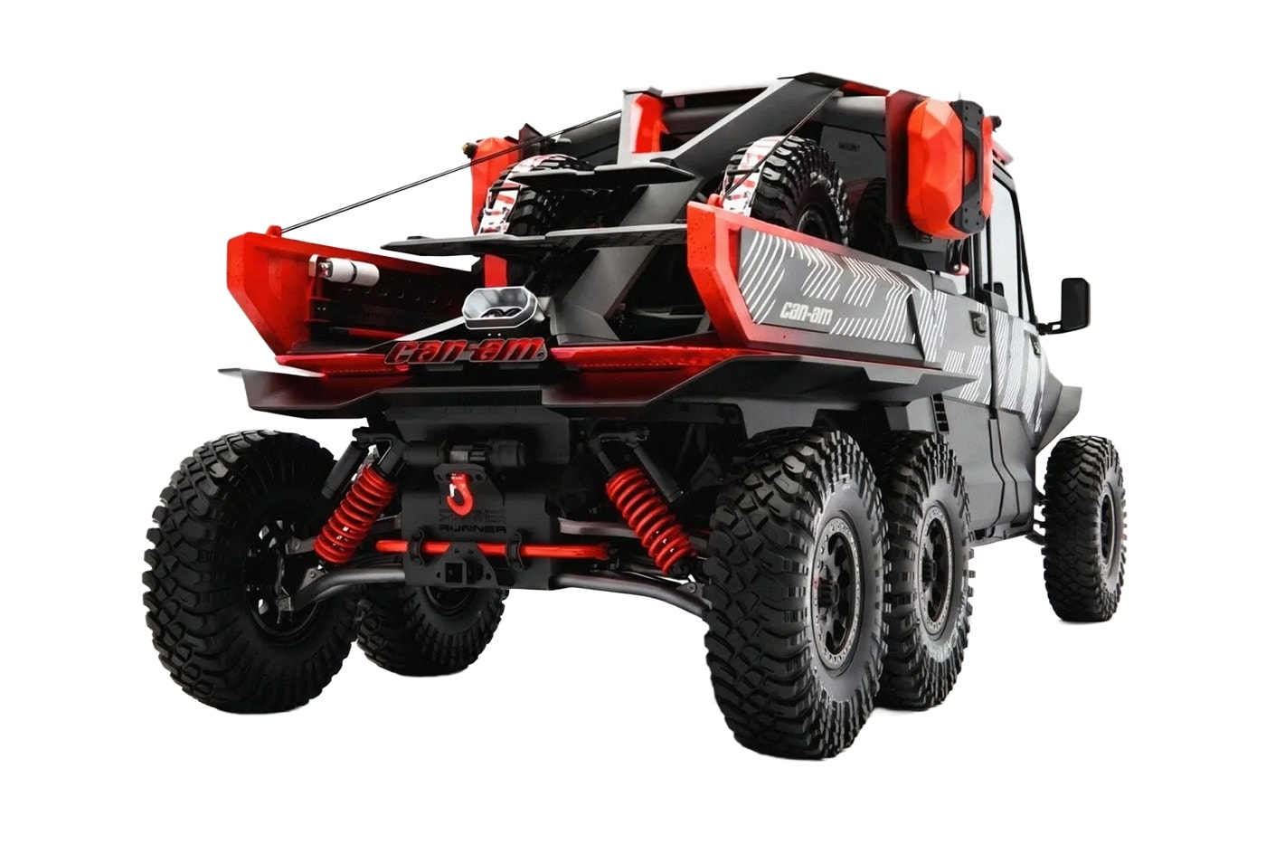 Can-Am Defender Prerunner and Maverick R XRay off-road concept vehicles displayed together at night