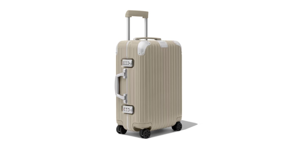 RIMOWA's Hybrid Suitcases Fuse Polycarbonate and Aluminum in a New "Gloss Stone Beige"