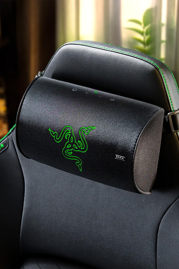 Razer Clio X wireless speaker head cushion mounted on a Razer gaming chair