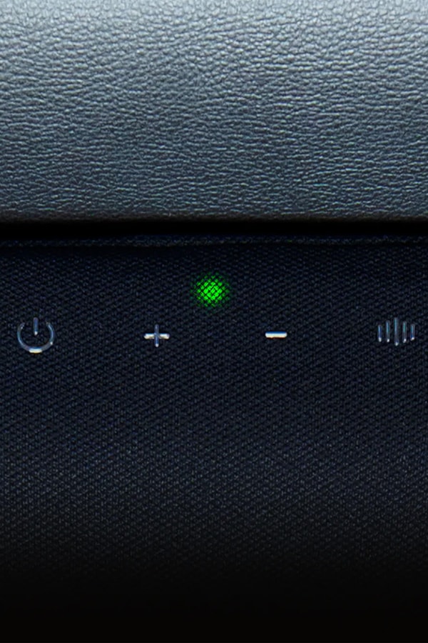 Razer Clio X wireless speaker head cushion mounted on a Razer gaming chair