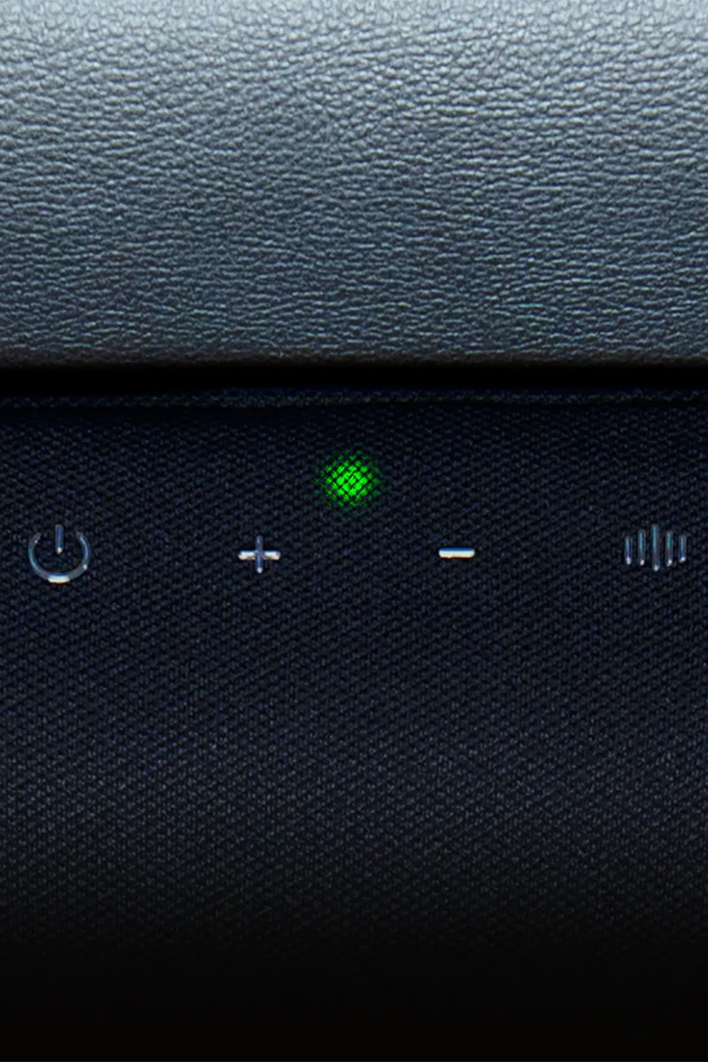 Razer Clio X wireless speaker head cushion mounted on a Razer gaming chair