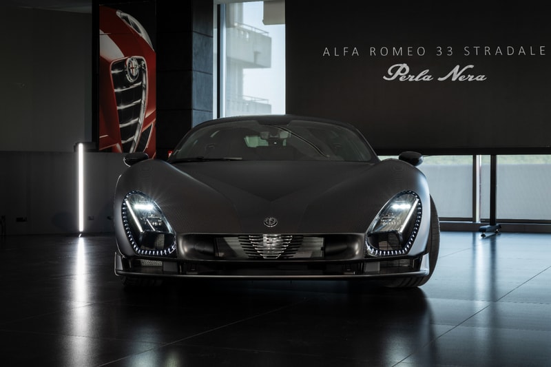 Alfa Romeo 33 Stradale Perla Nera featuring matte black exposed carbon fiber bodywork.
