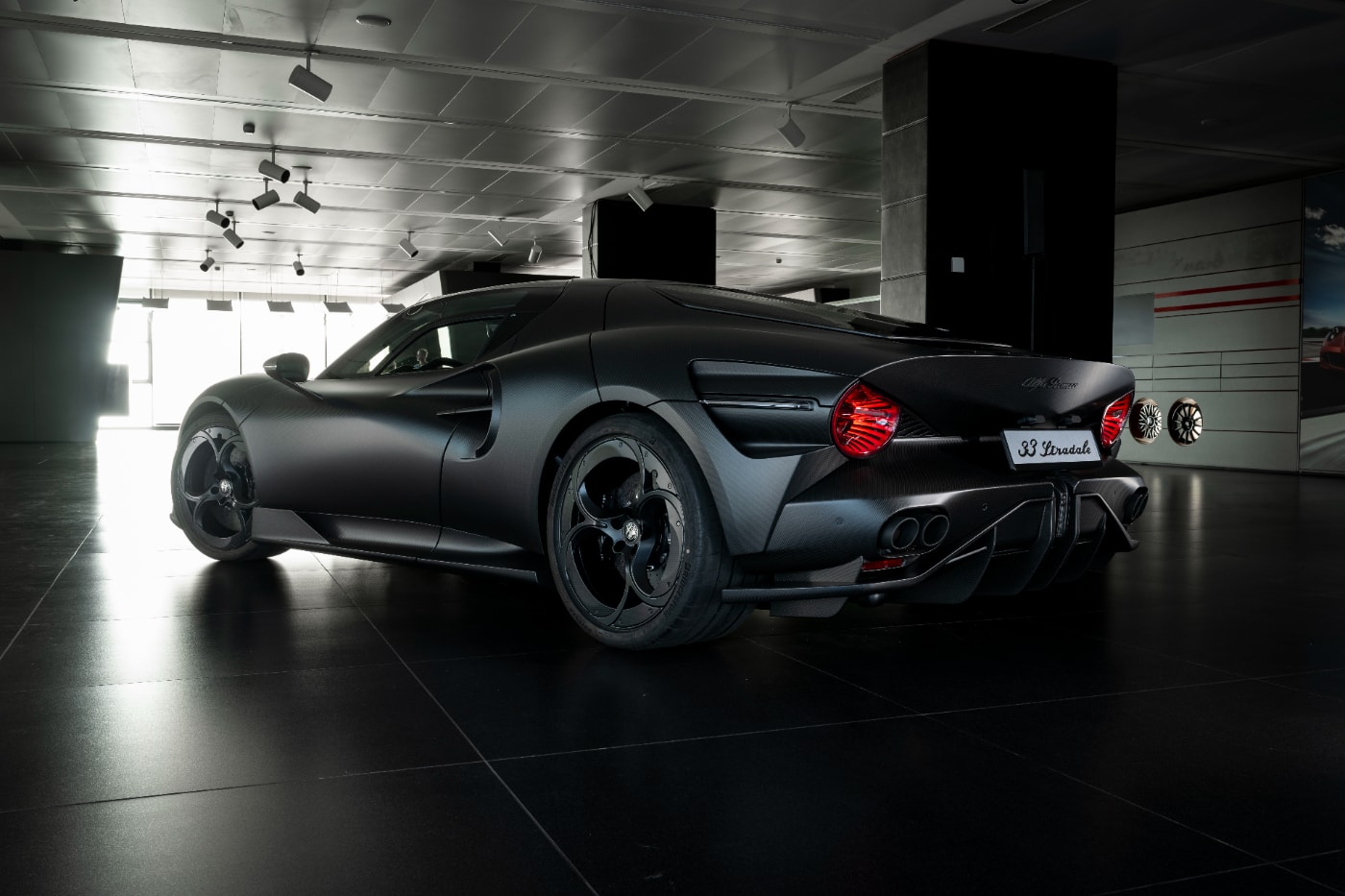 Alfa Romeo 33 Stradale Perla Nera featuring matte black exposed carbon fiber bodywork.