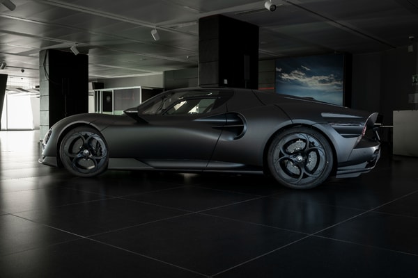 Alfa Romeo 33 Stradale Perla Nera featuring matte black exposed carbon fiber bodywork.